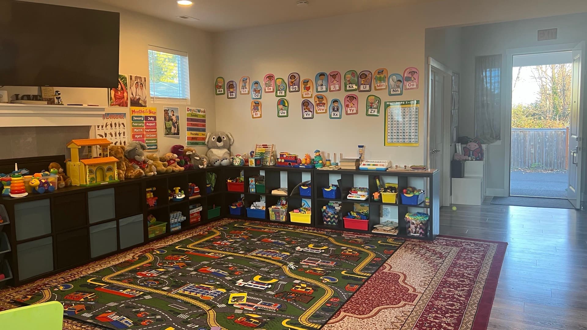 The Sunny Daycare playroom with daylight from the back door
